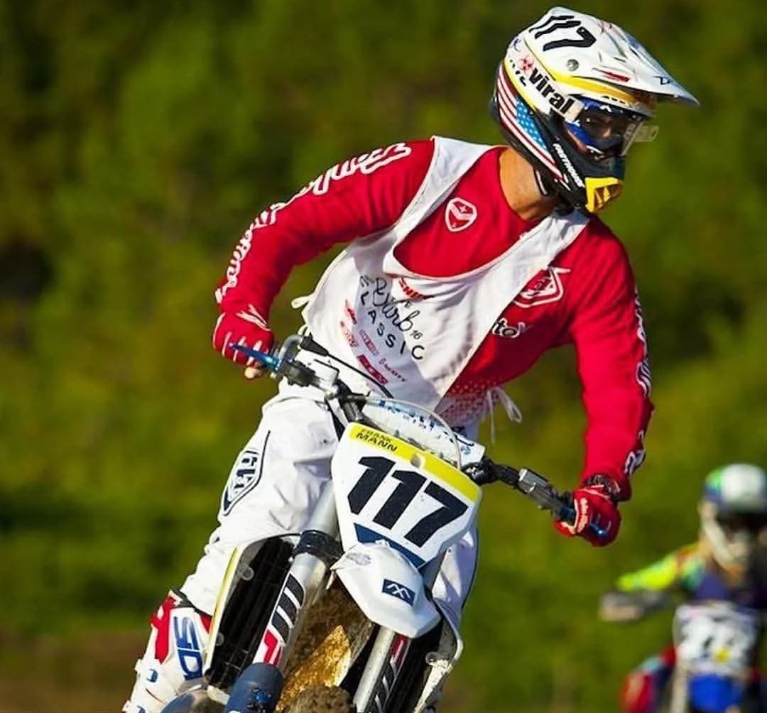 Frank leaning his number 117 bike through a turn